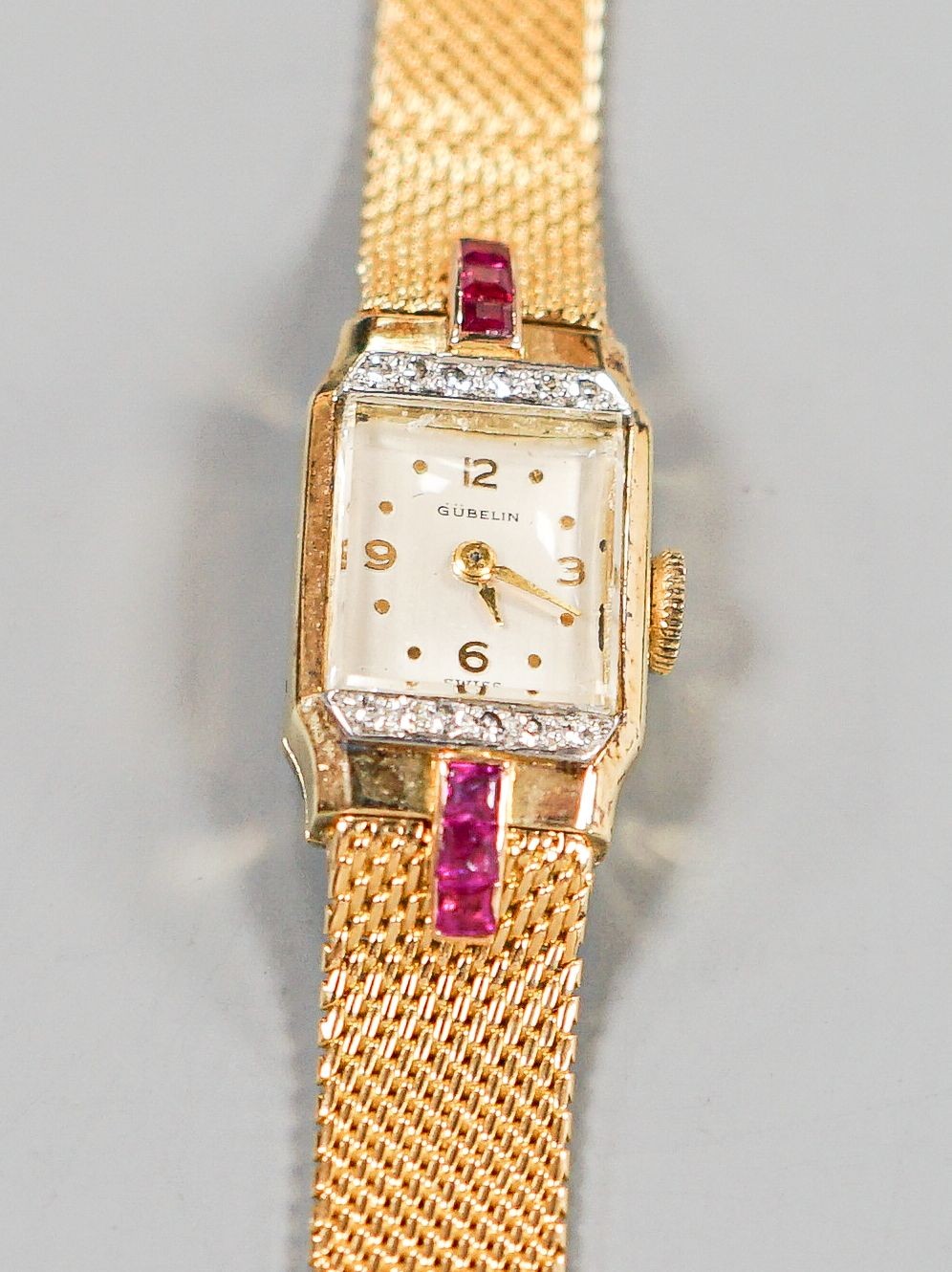 A lady's 18ct gold, ruby and diamond set Gubelin manual wind cocktail watch